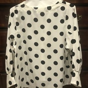 Polka dot rayon top. Exaggerated balloon sleeve.